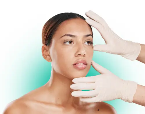 A plastic surgeon completes an assessment during an aesthetic appointment