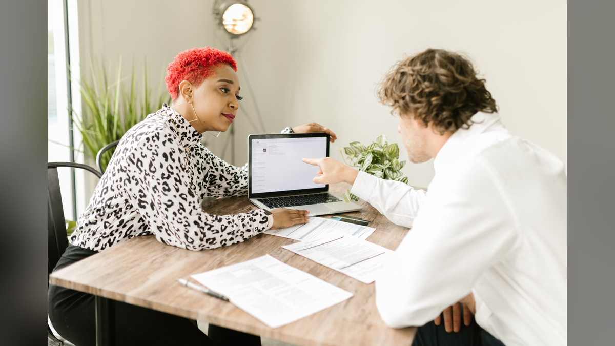 Marketing and compliance team members reviewing content together before publication